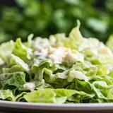 green salad in sour cream with eggs